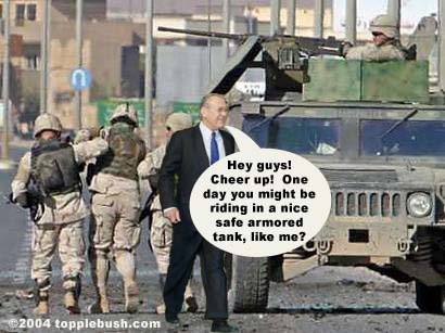 Rumsfeld surveys damaged Humvee in Iraq